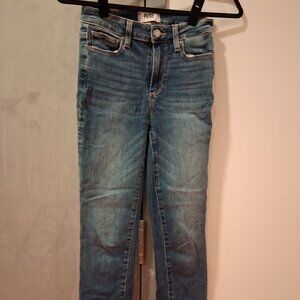 PAIGE skinny jeans featuring a classic five-pocket design and a frayed, raw-edge